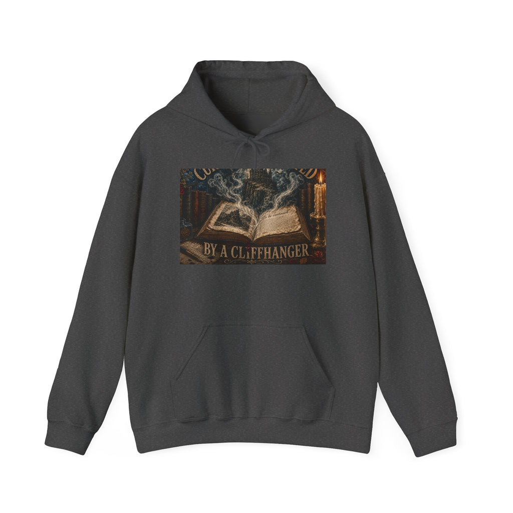 Dark Heather hooded sweatshirt printed with an open book, a misty cliffside castle, candlelight and 'Currently Haunted by a Cliffhanger'