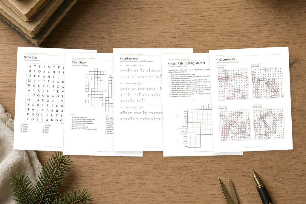 Inside pages of the Wisconsin Winter Puzzle Book spread out: word search, crossword, cryptogram and logic grid puzzles printed on white US Letter paper.